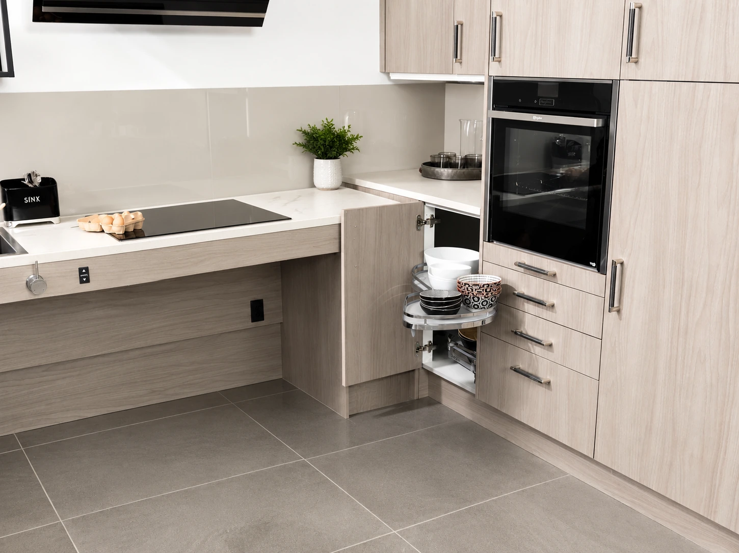 Accessible kitchen with open knee space and pull-out storage